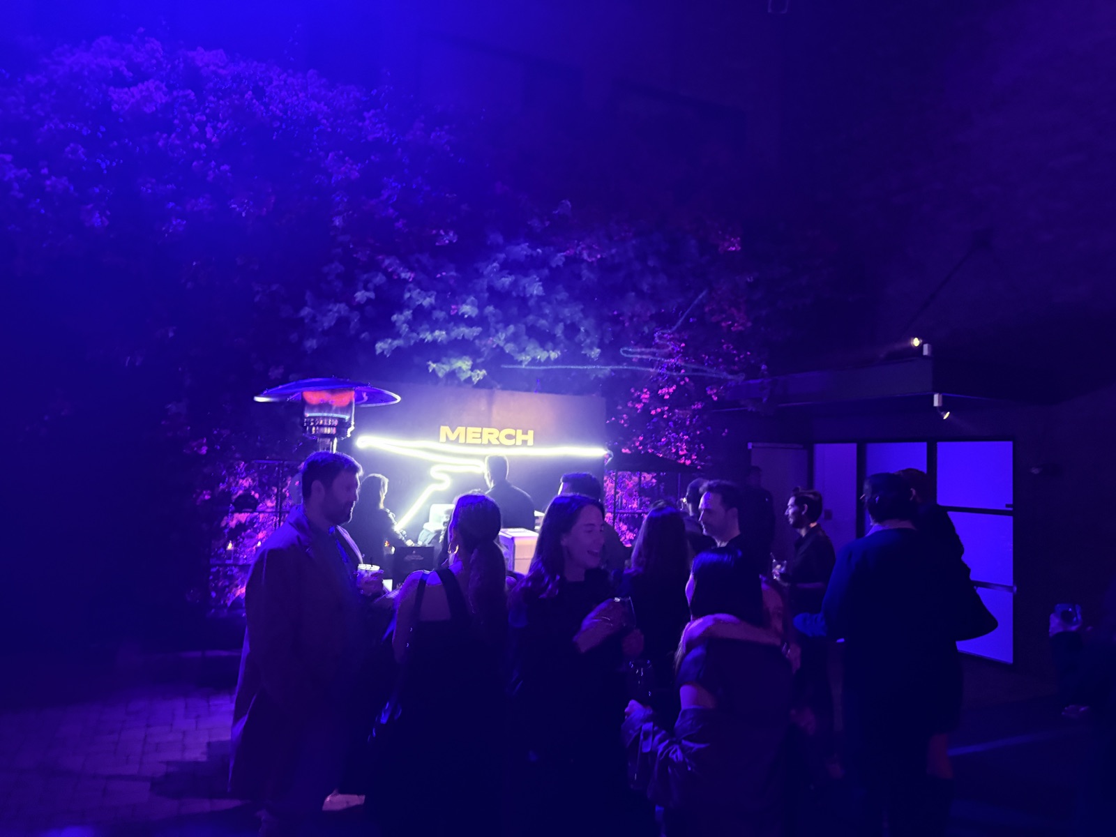 Guests gathered around a live merch activation