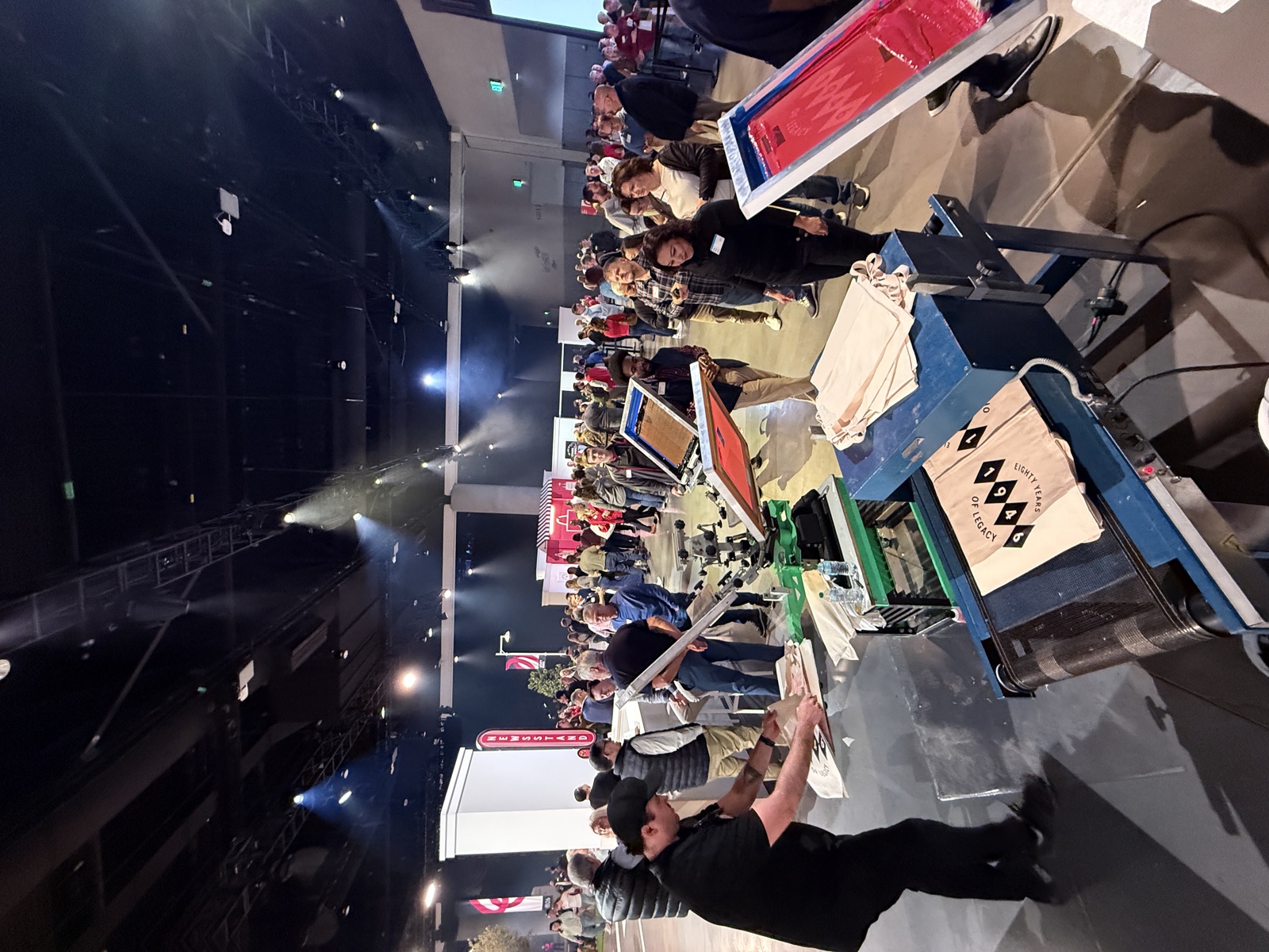 Live screen printing station with event crowd