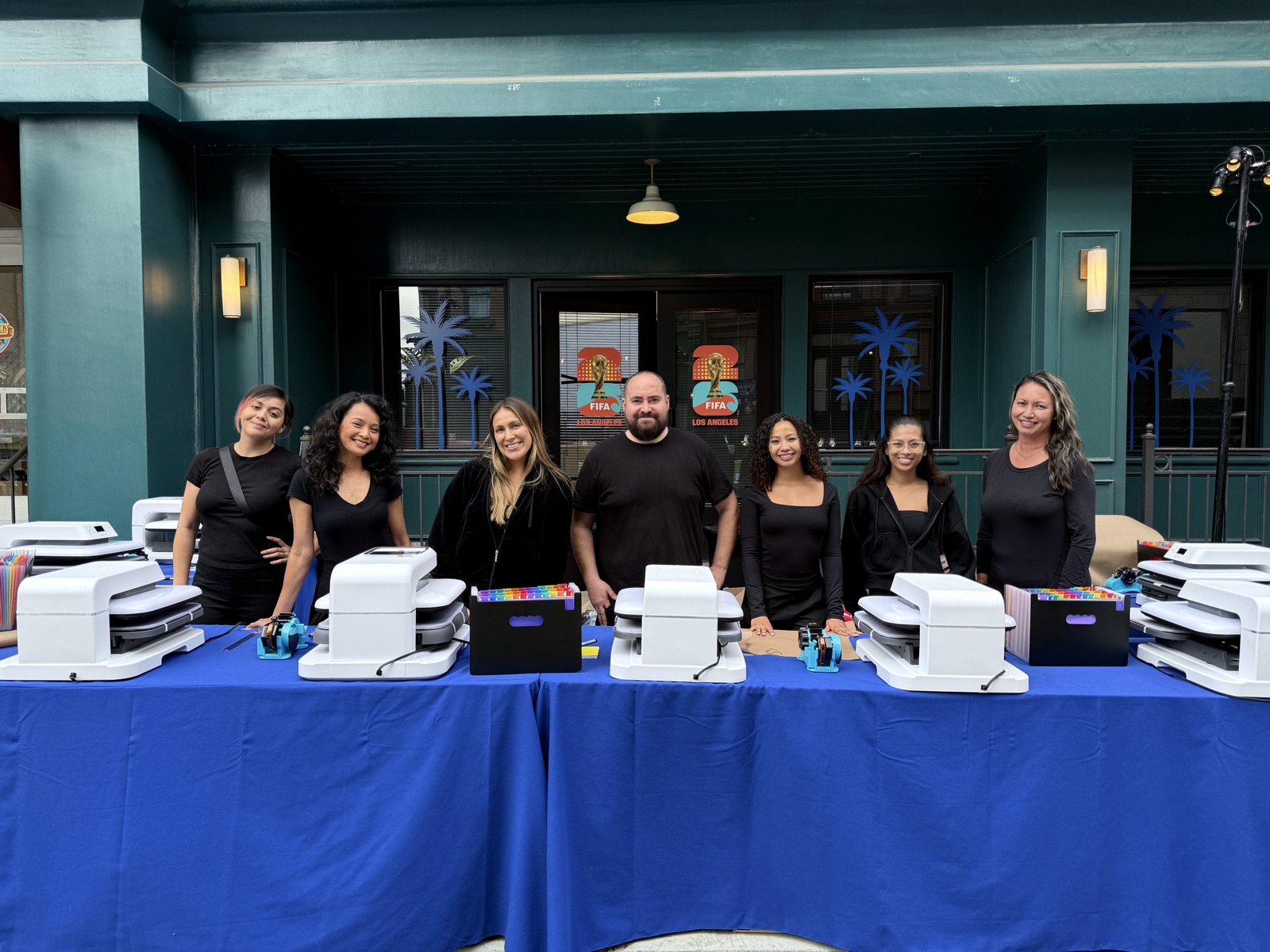 Heat press stations staged for live DTF transfer customization