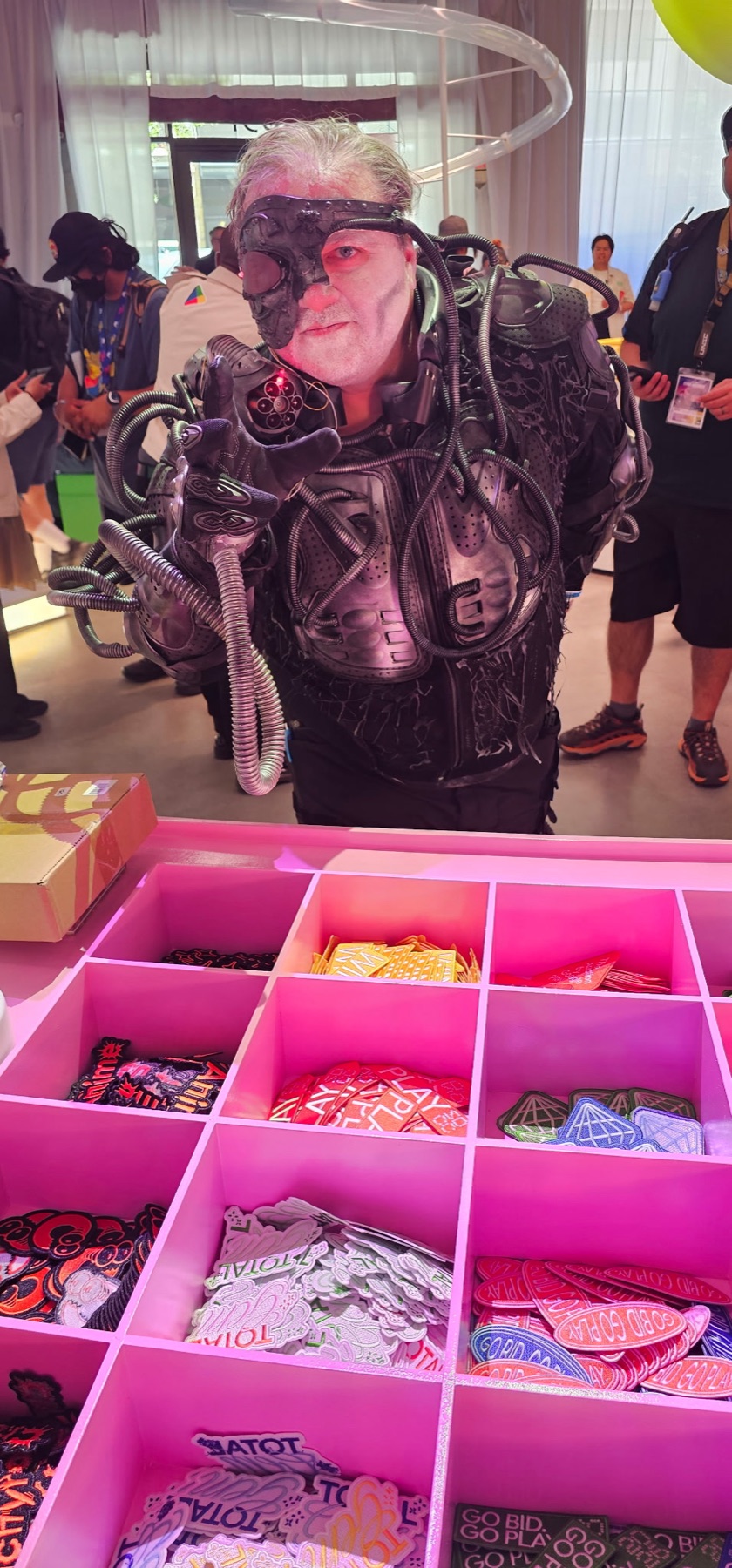 Guest choosing colorful embroidered patches at a live tote patch bar during San Diego Comic-Con